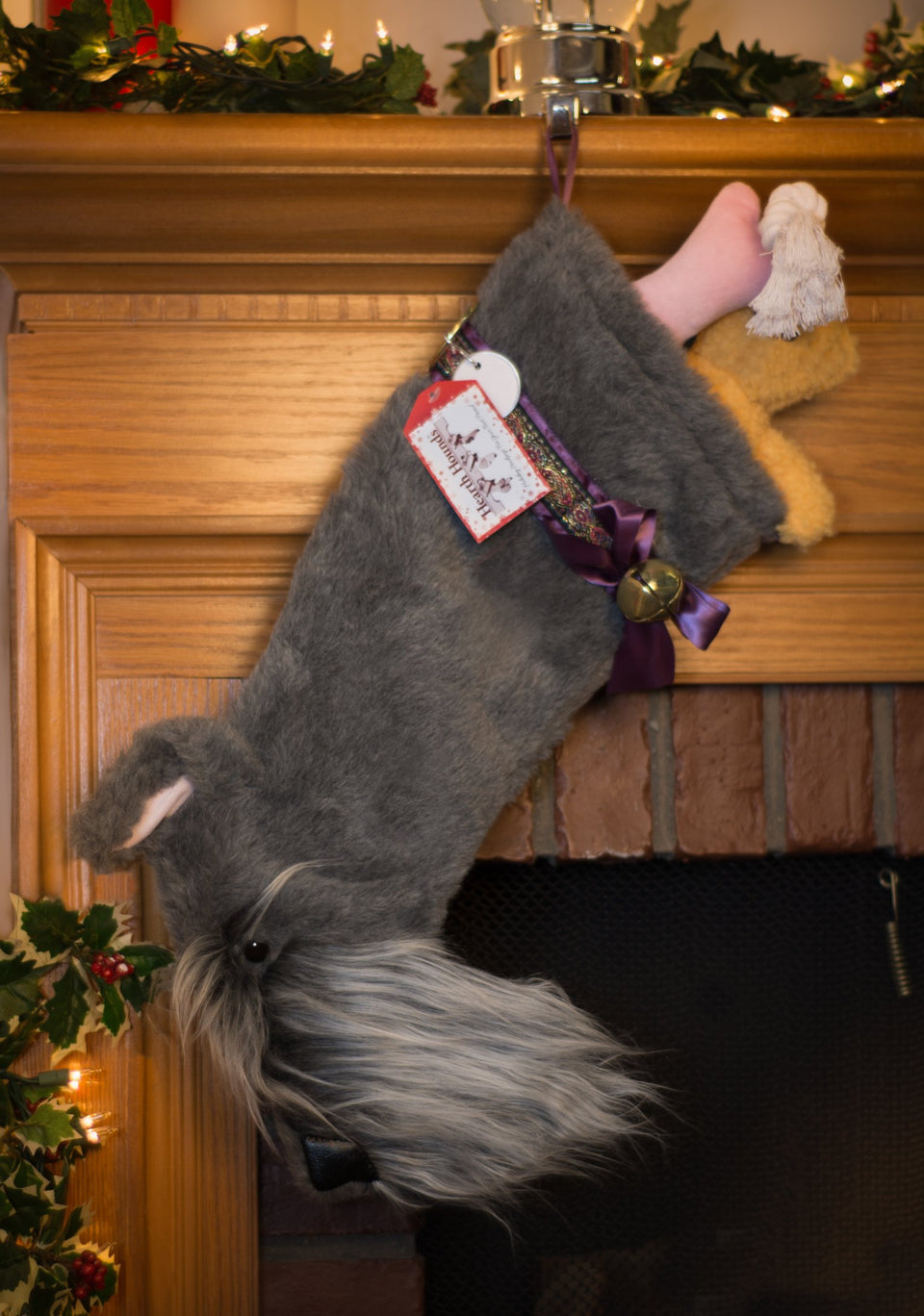 This Schnauzer shaped Christmas dog stocking is the perfect gift for stuffing toys and treats into to spoil your fur baby for Christmas, or whatever holiday you celebrate!