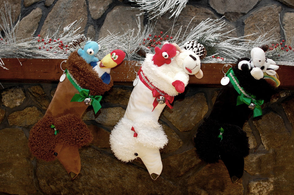 These Poodle shaped Christmas dog stockings are the perfect gift for stuffing toys and treats into to spoil your fur baby for Christmas, or whatever holiday you celebrate!